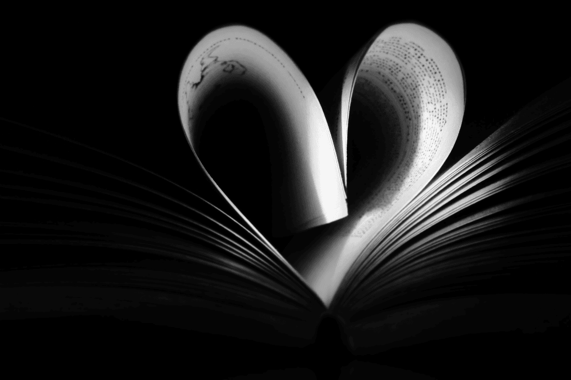 pages of a book folded into a heart shape